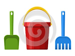 Red baby bucket, spade and rake isolated on white background. Toys set for children sandbox and playground, little
