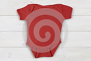 Red Baby Onesie Mockup on Wood Plank Background