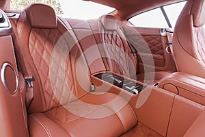 Red back passenger seats in modern luxury comfortable car