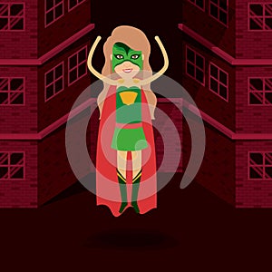 Red background buildings brick facade with superwoman standing in outfit with hand up