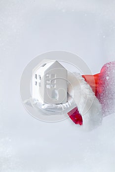 Red background hand Santa Claus white glove house home hold