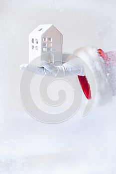 Red background hand Santa Claus white glove house home hold