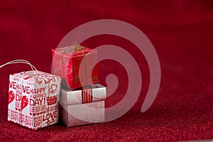 Red background image and gift box Valentine`s Day concept