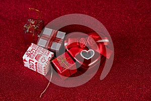 Red background image and gift box Valentine`s Day concept