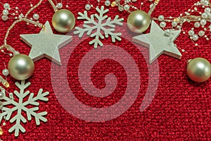 A red background with many matching Christmas accessories, such as stars