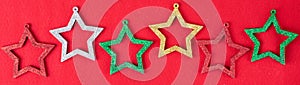 Red background with multicolored star decorations