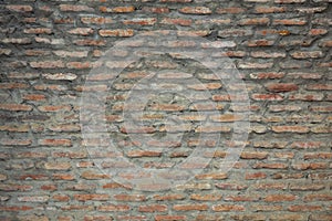 Red background of old vintage brick wall texture. Close up view of old stone brick wall with medieval masonry,
