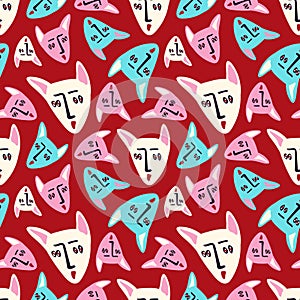 A red background with a pattern of cat faces