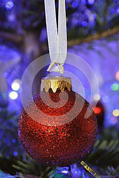 Red ball in christmas tree