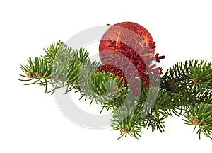 Red ball and red snowflake with branch of Christmas tree isolated on white background