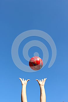 Red ball thrown in the air