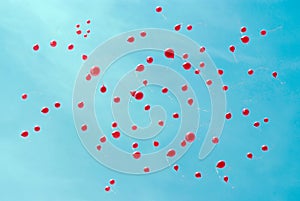 Red ballons in a blue sky