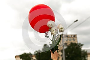 Red balloon and flowers in the air