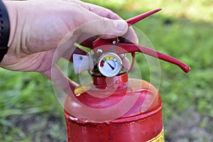 Red balloon hand extinguisher in the garden