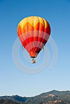 Red Balloon Over Colorado Mountains