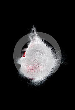 Red balloon with water exploded by bullet