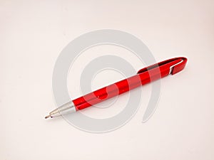 Red ballpoint pen isolated on white