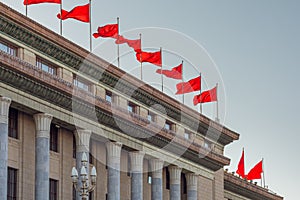 Red banners atop the National People`s Congress in Beijing, China