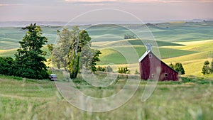 Red barn in the farmland of the Palouse at sunrise