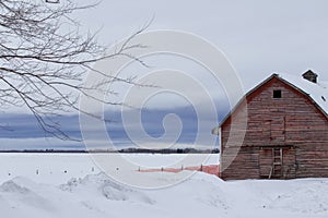 Red barn front in winter