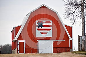 Red Barn with Heart Shaped Patriotic Quilt