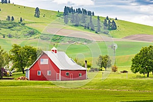 A red barn on a picturesque farm in the Palouse hills