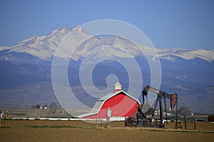Red Barn Pump Jack Oil well and Longs Peak