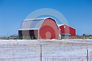 Red barn on snowy prairie. photo