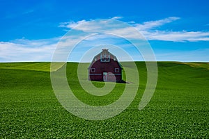 Red barn in the wheat fields of the Palouse region of eastern Wa