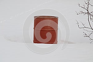 Red barrel on a white snow background