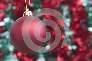 Red bauble and tinsel