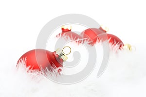 Red baubles in white feather