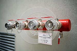 Red bayonets for connecting fire hoses in an industrial building