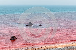 Red beach of Hormuz Island in Persian Gulf, southern Iran.