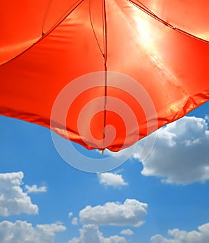 Red Beach Umbrella over blue sky