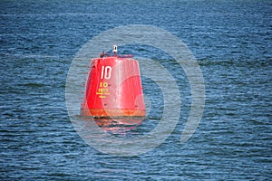 Red beacon buoy with speed limit of ten knots