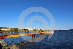 A red beacon light on a cement platform in the Strait of Canso near Port Hawkesbury Nova Scotia