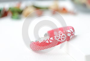 Red beaded bracelet with floral print