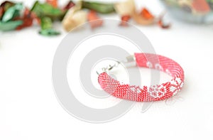 Red beaded bracelet with floral print