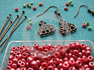 Red beads and pieces for making earrings, handmade jewelry