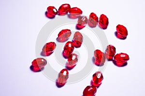 Red beads. Plastic beads. Faceted beads. Handmade beads. Crimson color. Bijouterie. Jewelry. Oblong