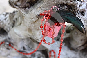 Red beads spread over an old snag