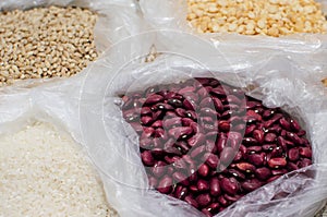 Red beans, peas, rice and pearl barley in bags. Cooking healthy meals at home