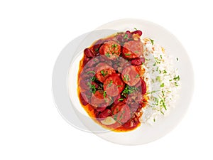 Red beans and rice with sausage on plate isolated on white