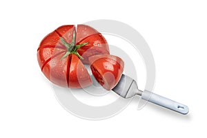 Red beautiful tomato, cut into pieces like a cake. a piece on the cake spatula. Vegetarian healthy food. isolate on a