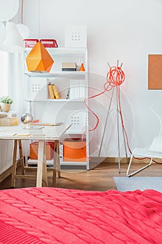 Red bedcover in modern bedroom