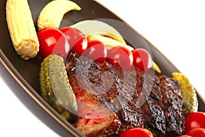 Red beef meat served with corns