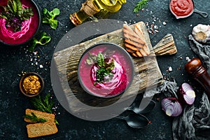 Red beet soup with sour cream. Ukrainian cuisine, Borsch soup. Top view. Free space for your text.