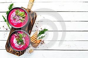 Red beet soup with sour cream. Ukrainian cuisine, Borsch soup. Top view. Free space for your text.