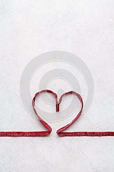 Red beetroot pasta shaped as heart. Valentines Day greeting card